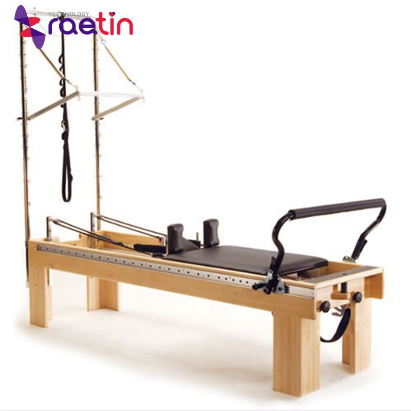 Pilates exercise equipment elevated Cadillac bed